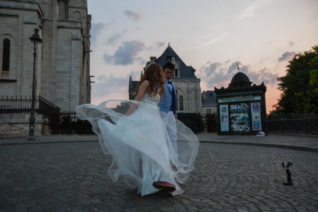Couple dancing at sunrise at the Sacre couer in Paris